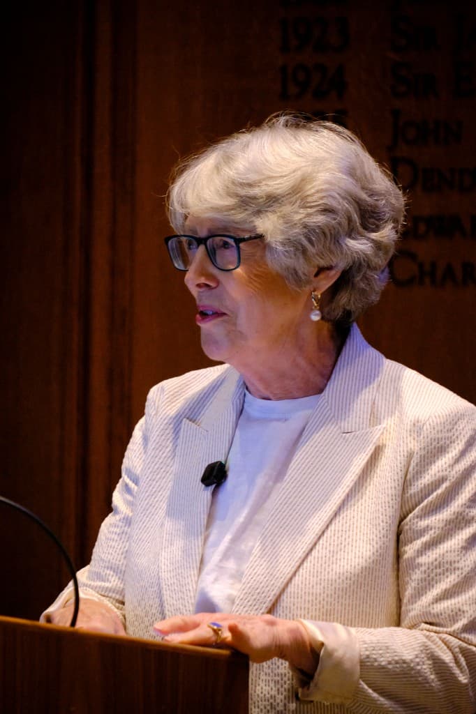 Dame Patricia Hewitt speaking at the podium